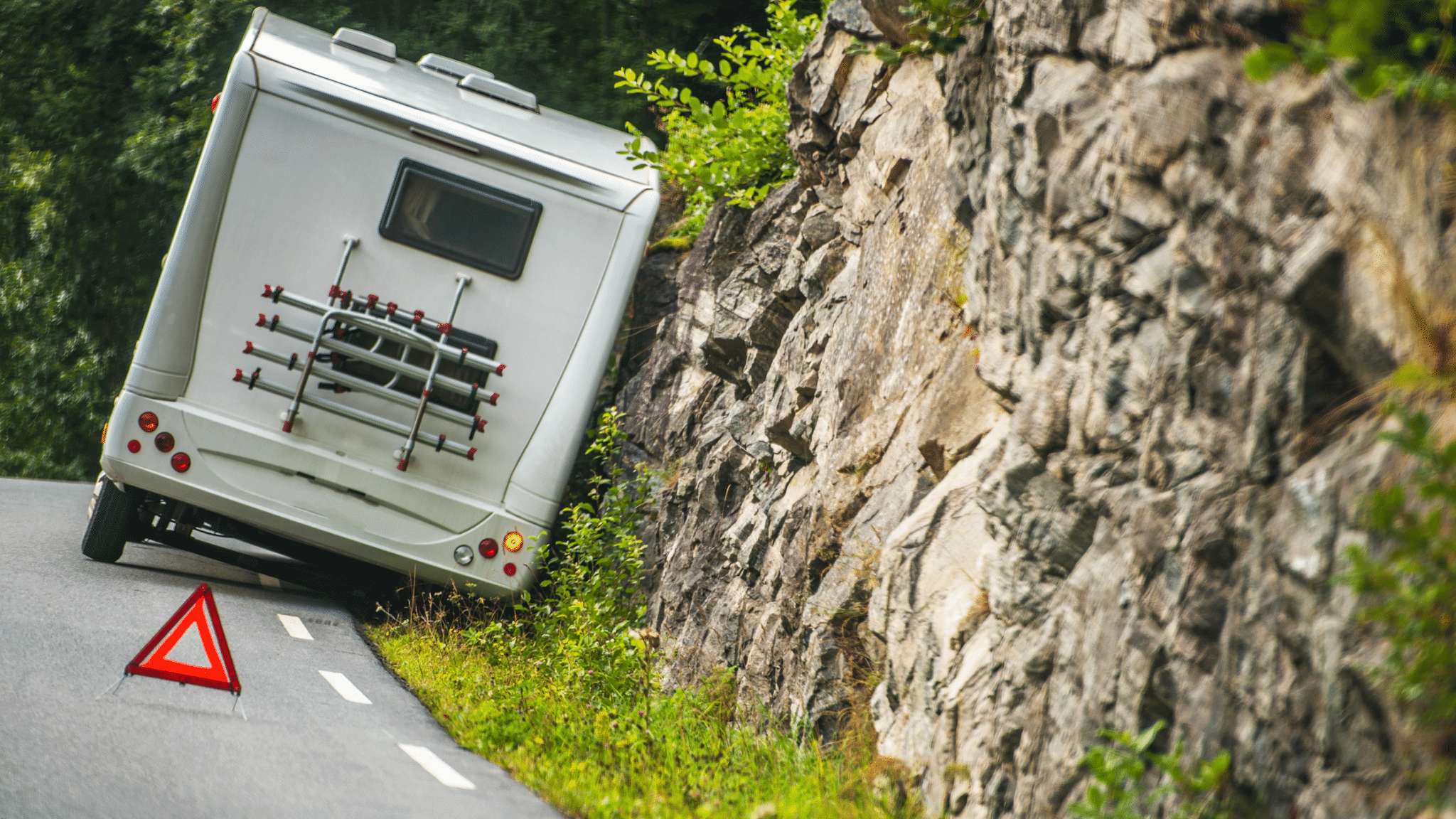 RV on the side of the road with a safety cone deployed