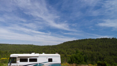 A large RV is ready to boondock in the gorgeous green mountains! Even better if they're prepared with the best boondocking tips for a big rv!