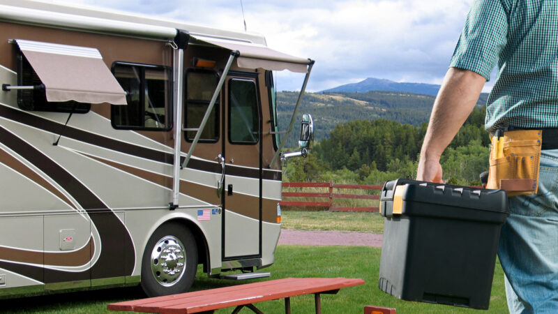 man with his RV tool kit about to work on his RV