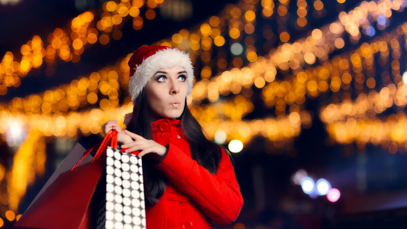 Women with shopping bags from black friday deals