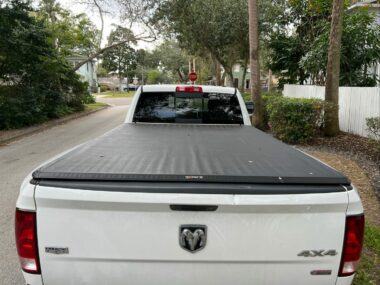 A Ram truck bed cover protects the bed from debris and theives.