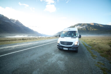 A mercedes-motorhome driving in the mountains.