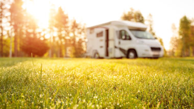 An RV parked at a good sam club campground