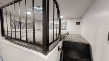A loft inside a midbunk RV in a Forest River Cedar Creek fifth wheel