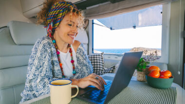 A woman booking their next camping reservation through arvie