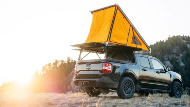 A ford maverick camper parked outside