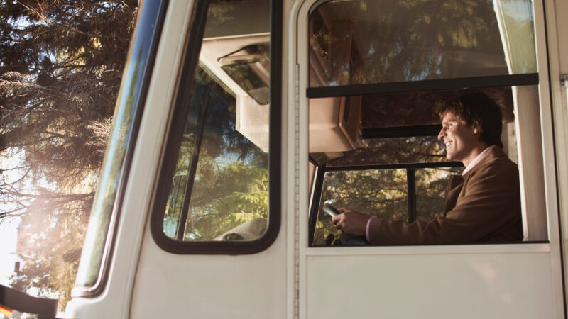 A man driving an RV