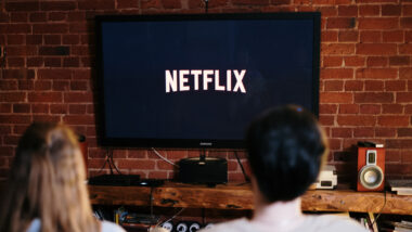 A couple watching Netflix inside their RV