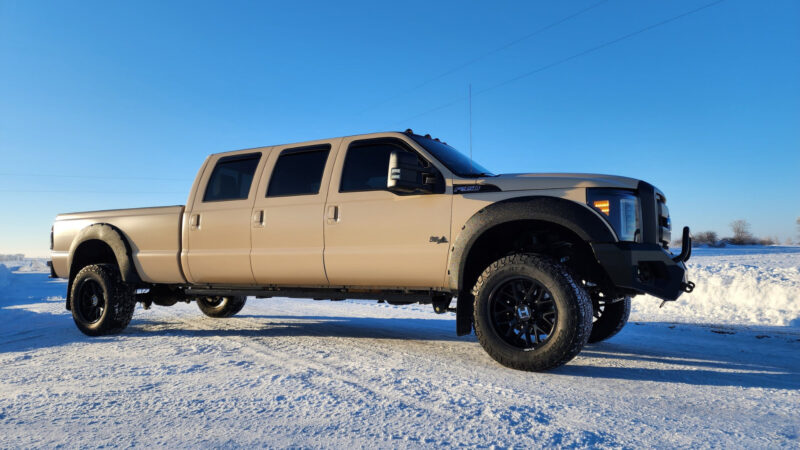A 6 door truck parked outside