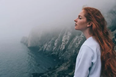 Woman looking out at Neahkahnie Viewpoint