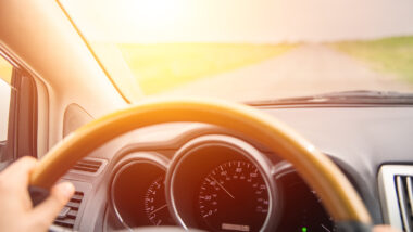 A person driving on a washboard road