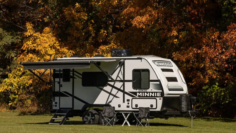 A winnebago micro Minnie parked outside