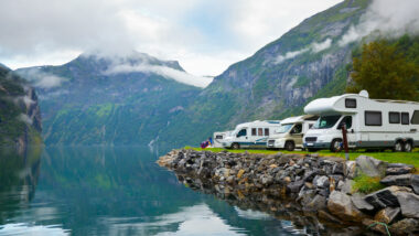 RVers parked at a campground by a lake