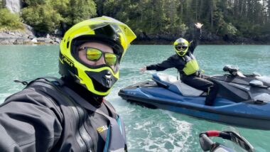 A couple taking a selfie on a JetSki during a Glacier JetSki Adventures Tour.