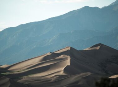 Great Sand Dunes National Park dunes with mountain range in the background.