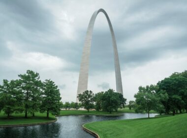 Gateway Arch National Park with a creek flowing in the foreground.