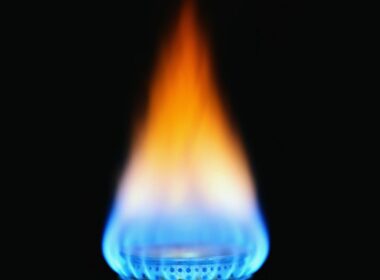 Natural gas aflame with black background.