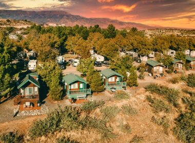 An aerial view displaying the location of Verde Valley against a setting sun, blazing the sky in orange and pink hues.