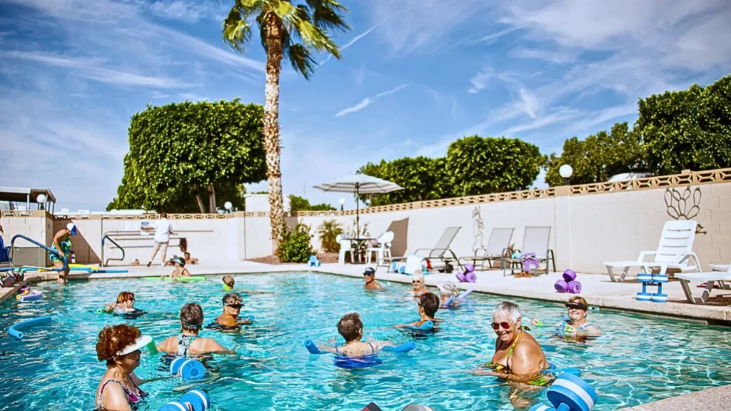 Seniors in the swimming pool enjoying aquatic arobics at the Catus Gardens RV Resort in Yuma, AZ. 
