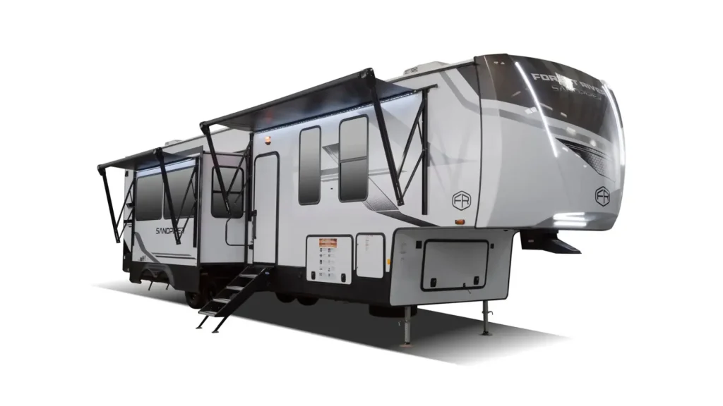 The outside of the Forest River Sandpiper 4002FB, showcasing the pull out, awnings, and mocha, grey, and white paint job. 