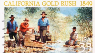 A scene of miners looking for gold in a torreent reproducted in a stamp.