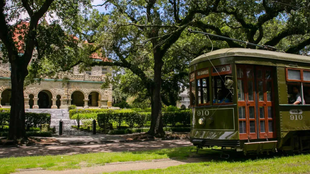 A photo of the garden district with the trolly driving through the area.