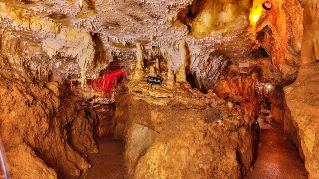 A photo of the Crystal Lake Cave in standard light, showcasing a plethora of cave formations. 