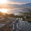 An aerial of Corrine, UT, as the sun sets over the town.