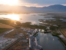An aerial of Corrine, UT, as the sun sets over the town.