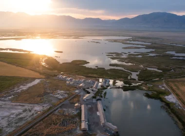 An aerial of Corrine, UT, as the sun sets over the town.