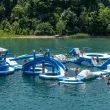 France Park aerial of an inflatable play park floating atop the lake within the park as people play on it.