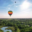 The Sunflower Balloon Festival, Anthony, Kansas, as two hot air balloons floating in the blue sky.