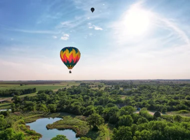 The Sunflower Balloon Festival, Anthony, Kansas, as two hot air balloons floating in the blue sky.