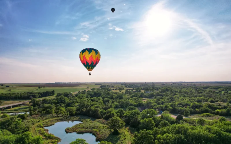 The Sunflower Balloon Festival, Anthony, Kansas, as two hot air balloons floating in the blue sky.